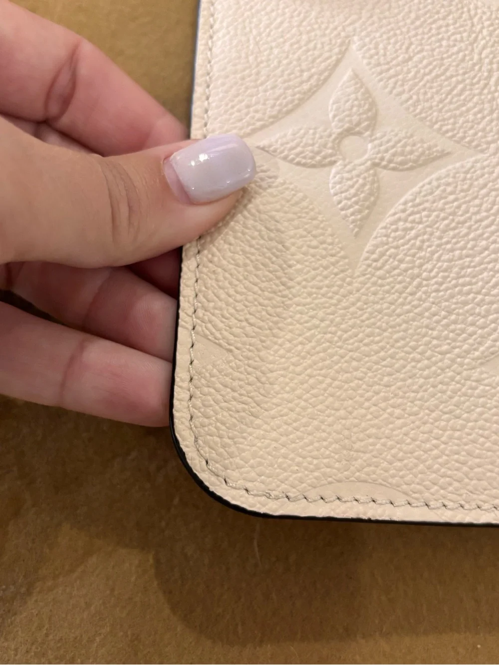 Authentic Louis Vuitton Neverfull GM Empreinte cream monogram pouch wristlet